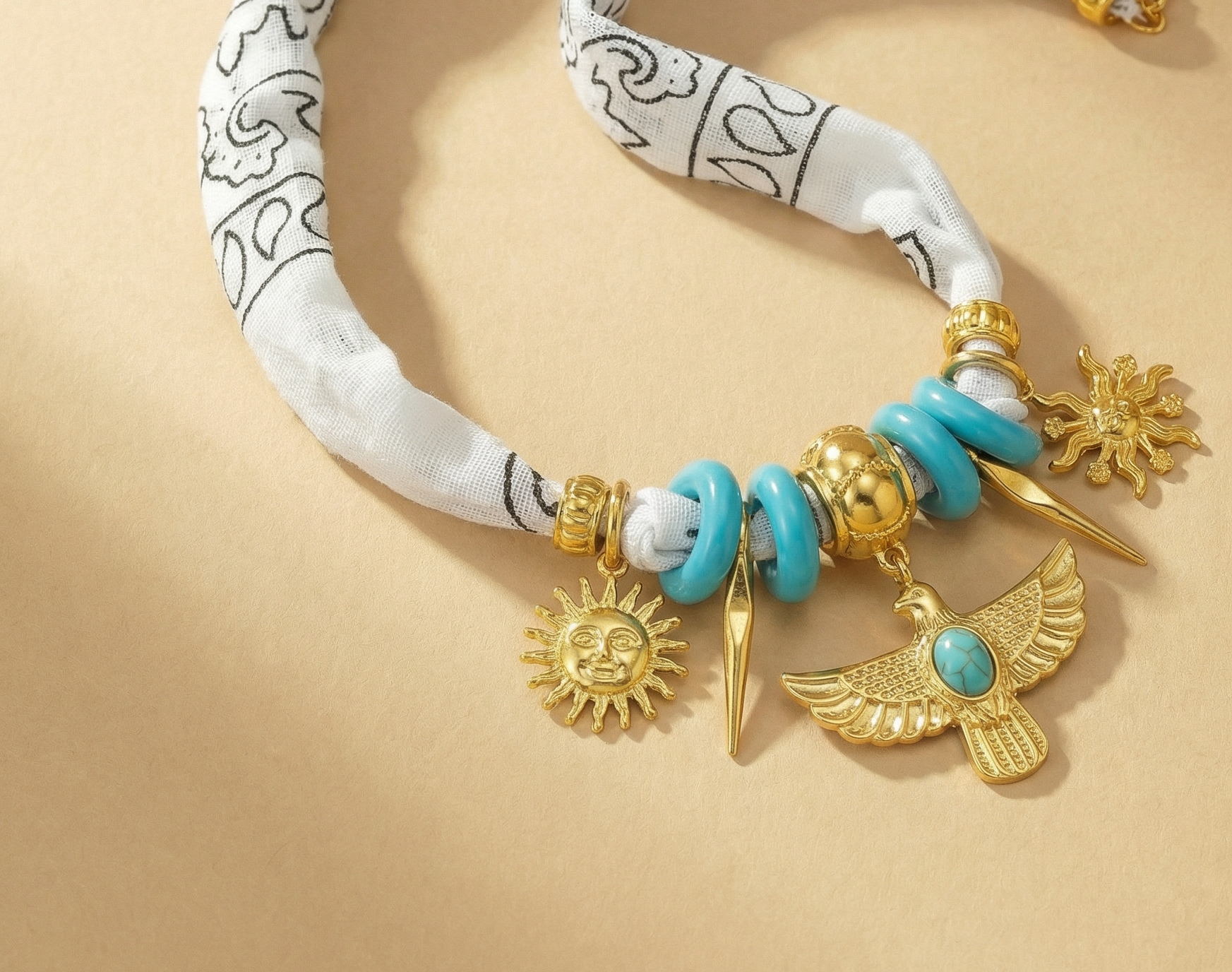 White scarf necklace with native inspired gold charms