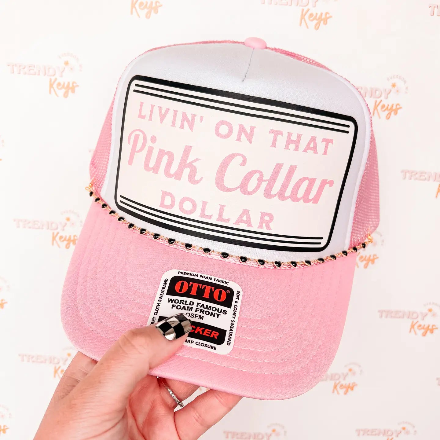 Livin' on that pink collar dollar trucker hat