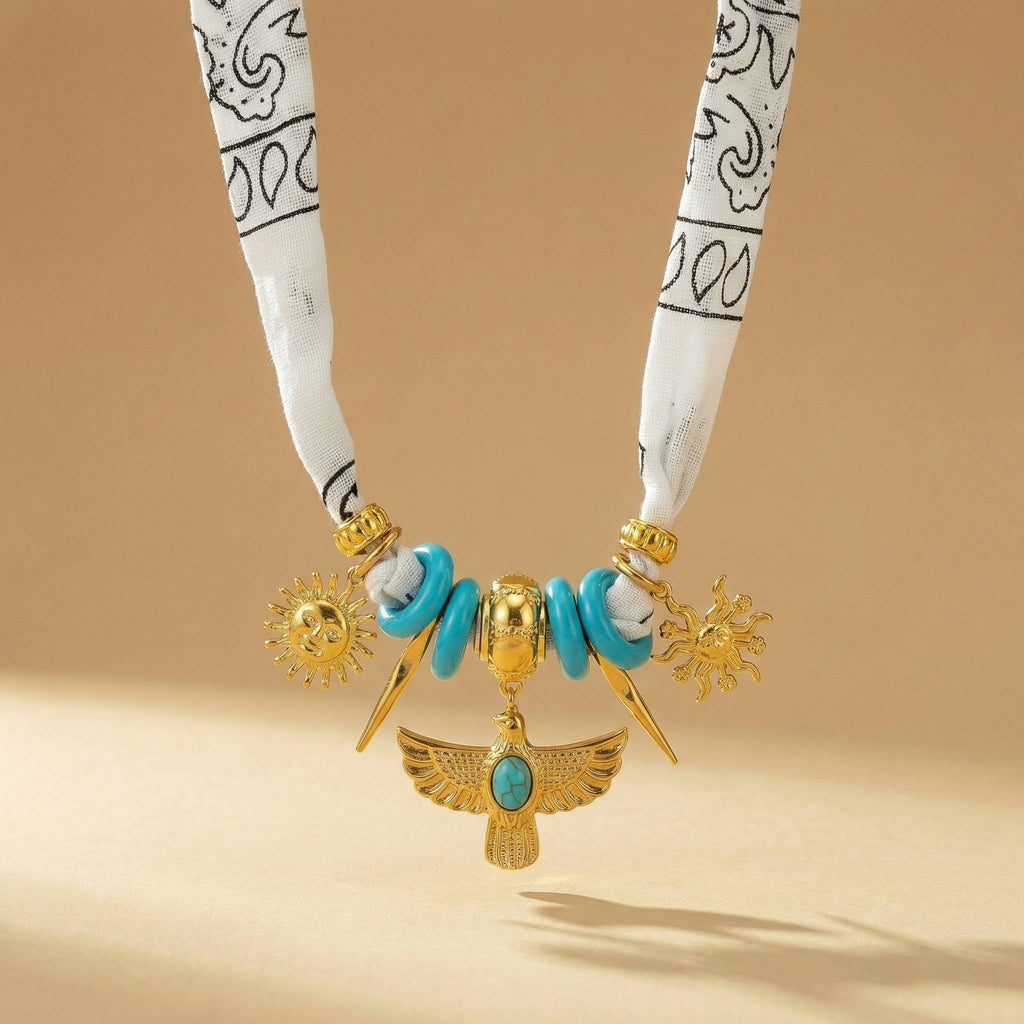 White scarf necklace with native inspired gold charms